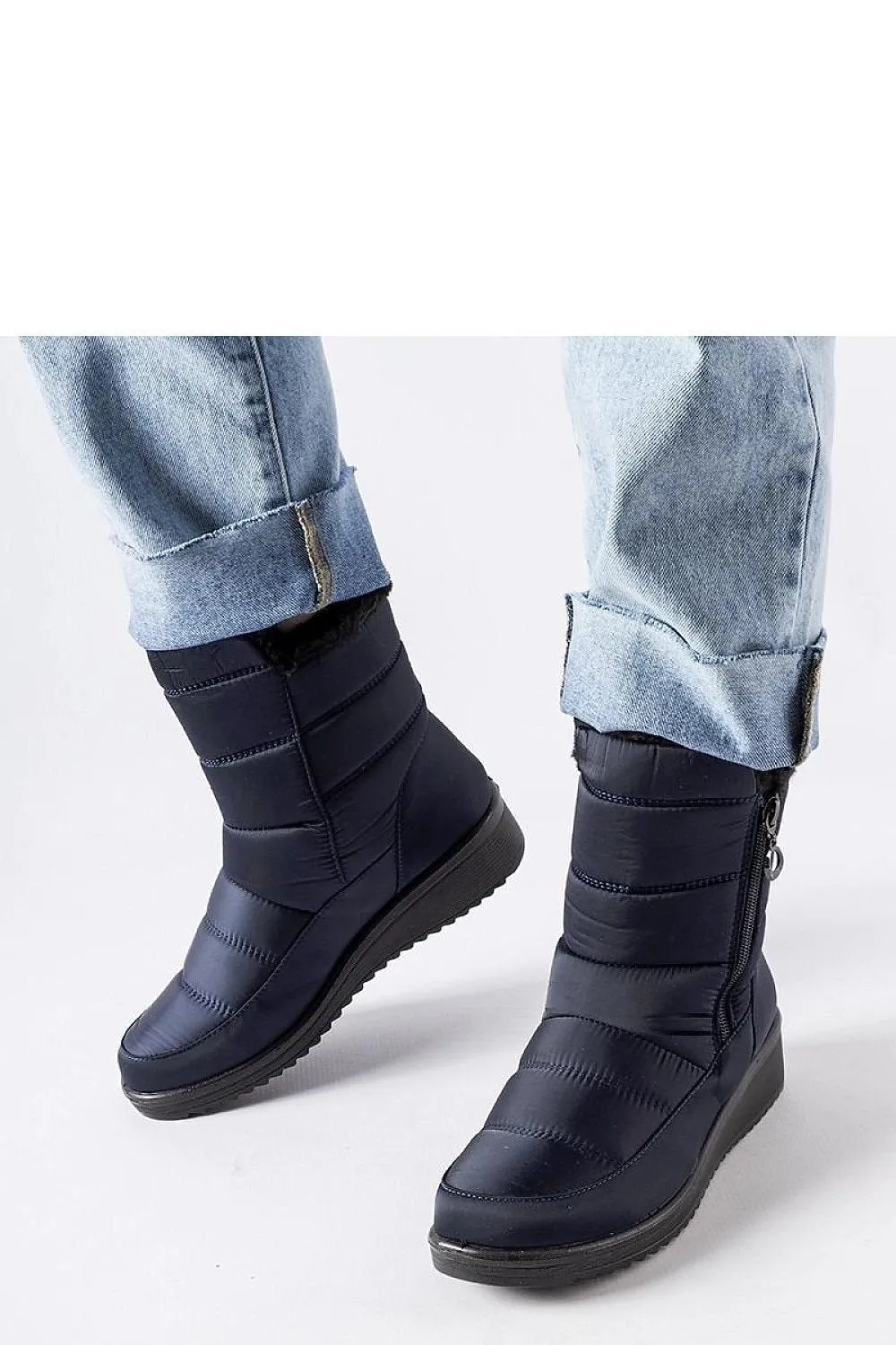 Navy snow boots with a low Mount wedge
